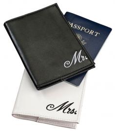 Each passport cover fits a standard-sized passport (there are two pockets on the inside for inserting the passport). This set includes one black passport cover with the word "Mr." embroidered in white and one white passport cover with the word "Mrs." embroidered in black. Each is made of leatherette and measure 4" x 5.5".