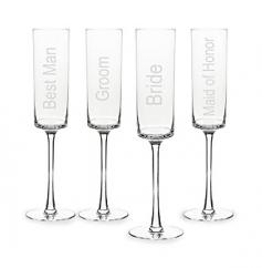 Modern and toast-worthy, the Wedding Party Champagne Flutes are sold in a set of four and engraved with Bride, Groom, Maid of Honor, and Best Man. Dimensions: Measure 10.5 in. H w/ a 2.5 in. diameter. Hold up to 8oz. Quantity: Sold in a set of (4) four Features: Modern, square-shared bells, custom etched with Bride, Groom, Maid of Honor and Best ManMaterials: Clear glass. Please Note: With hand blown glass, expect minor bubbles and swirls that are inherent to hand-blown glass. Variations will occur on styles due to their hand-crafted nature. Care Instructions: Dishwasher safe Engraving Options: Available as shown only. See More Photos for additional views*For personalization items please submit your request to personalizeinfo@alihamsgiftoutlet.com with engraving details.