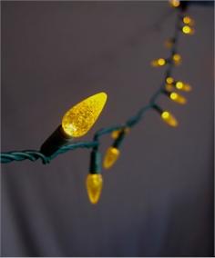 This is our LED C6 strawberry string light set in the yellow color. Our yellow LED lights will brighten up any holiday display or event. This string light has a non removable high quality LED light bulb. This set is UL Listed and rated for indoor and outdoor use. Product Details: - Includes 70 LED Yellow Bulbs - 4.8 Watts Per Set - Commercial Rated with Non-Removable Bulbs - Green Cord w/ UL Listed Male and Female Plug - Bulb Size 1.125"H x 0.5"W - Connects End to End - Full Wave Technology - No Flickering of Lights - String Length - 24' Long / 4" Spacing Between Bulbs - Includes Extra Fuse - If One Bulb Burns Out - Rest Of String Will Stay Lit - UL Listed For Indoor/Outdoor Use