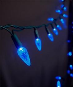 This is our LED C7 string light set in the blue color. Our blue LED lights will brighten up any holiday display or event. This string light has a non removable high quality LED light bulb. This set is UL Listed and rated for indoor and outdoor use. Product Details: - Includes 25 LED Blue Bulbs - 4.8 Watts Per Set - Commercial Rated with Non-Removable Bulbs - Green Cord w/ UL Listed Male and Female Plug - Bulb Size 1.5"H x 0.875"W - Connects End to End - Full Wave Technology - No Flickering of Lights - String Length - 16' 8" Green Cord with 8" Spacing Between Bulbs. - Includes Extra Fuse - If One Bulb Burns Out - Rest Of String Will Stay Lit - UL Listed For Indoor/Outdoor Use