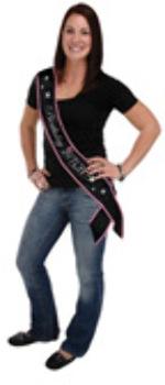 Make this birthday extra fun by finishing off your outfit with this Birthday Bitch Satin Sash. Wear the Birthday Bitch Satin Sash out to celebrate to let everyone know that its your birthday. The Birthday Bitch Satin Sash is a very stylish accessory to go with what every outfit you pick out to wear to celebrate your day. The sash is made from a satin like material and has a black background with a hot pink trim. The lettering on the birthday sash is white in fancy style writing saying Birthday Bitch. Sashes are made to be worn with the top over your shoulder going diagonally down your body. Each satin sash measures 33 by 4. Material: Satin-like Fabric. Black sash with White text and pink and white accents.