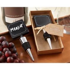 We never outgrow our love for chalk and something to use it on-it's been with us since childhood! Bring back fond memories and thank your guests with this traditional trendsetter-a Kate Aspen chalkboard-topped wine bottle stopper. Don't forget the chalk! Artistically accented, square chalkboard sits atop plastic base with black-rubber gasket. Stopper measures 4 3/4" h x 1 3/4" w.Presentation includes stopper, accented with natural-raffia bow, in open kraft tray on corrugated background. Gift presentation measures 5 1/2" l x 2 1/2" w.